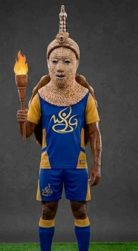 WAUG 2026 official mascot in blue and gold sportswear holding a torch